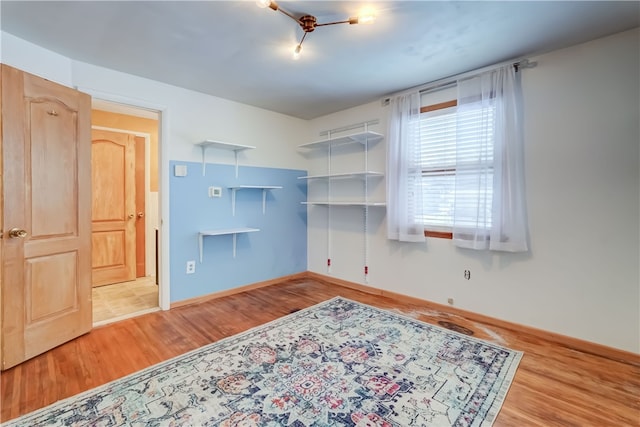 spare room with light hardwood / wood-style flooring