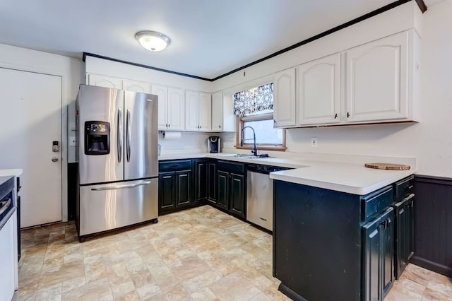 kitchen featuring sink, stainless steel appliances, and white cabinets