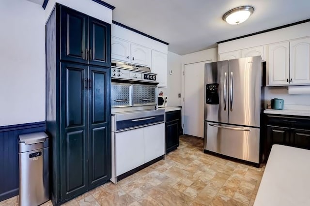 kitchen featuring white cabinetry and appliances with stainless steel finishes