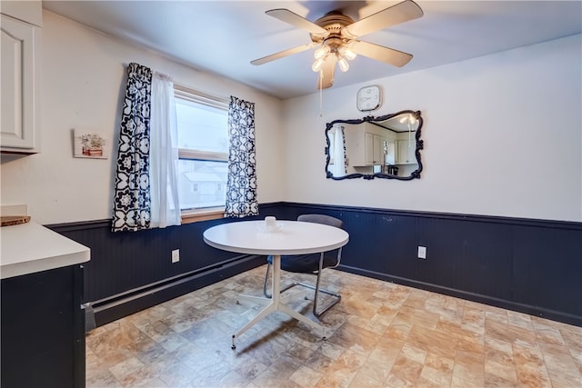 bathroom with ceiling fan and a baseboard radiator