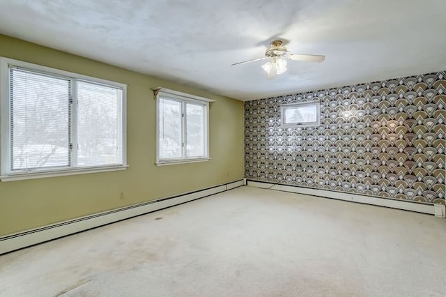 unfurnished room featuring ceiling fan, a baseboard radiator, and light carpet