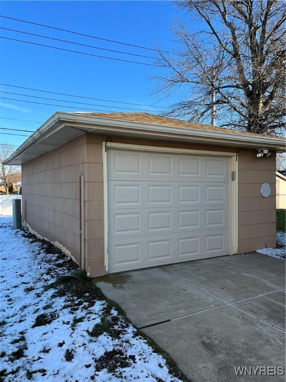 view of snow covered garage