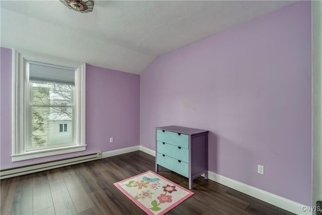 bonus room with a baseboard radiator, dark hardwood / wood-style flooring, and vaulted ceiling