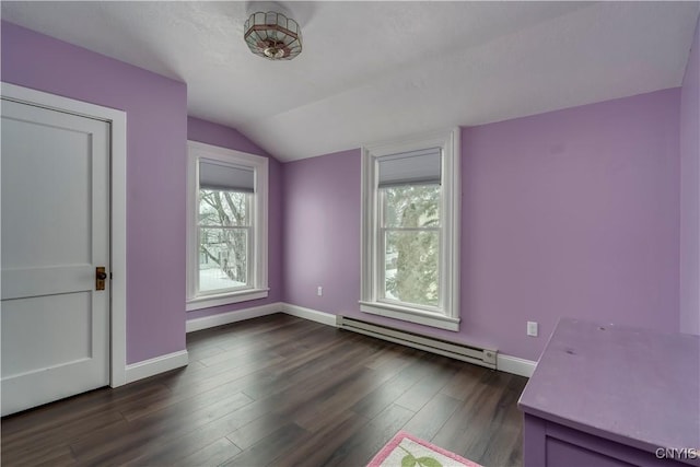 unfurnished bedroom featuring dark hardwood / wood-style flooring, lofted ceiling, and baseboard heating