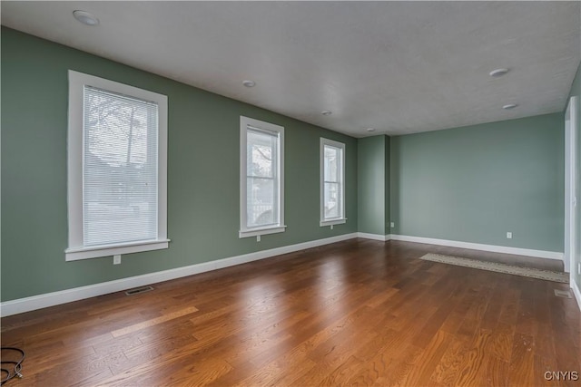 empty room featuring hardwood / wood-style floors