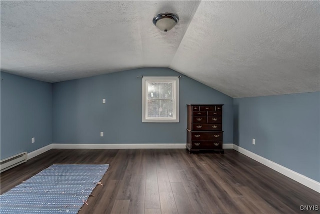 bonus room with vaulted ceiling, a baseboard heating unit, a textured ceiling, and dark hardwood / wood-style flooring