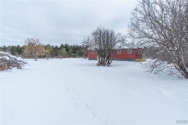 view of yard covered in snow