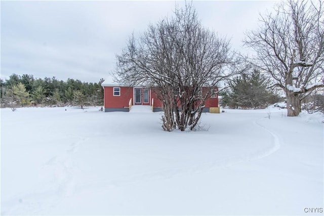 view of yard layered in snow