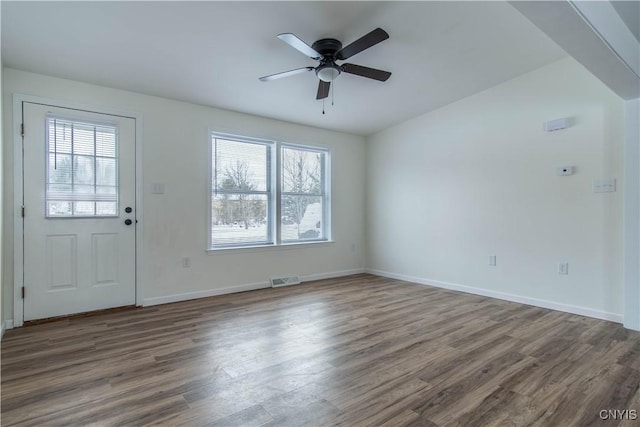 foyer with dark hardwood / wood-style floors and ceiling fan