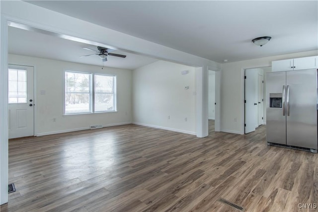 unfurnished living room with hardwood / wood-style floors and ceiling fan