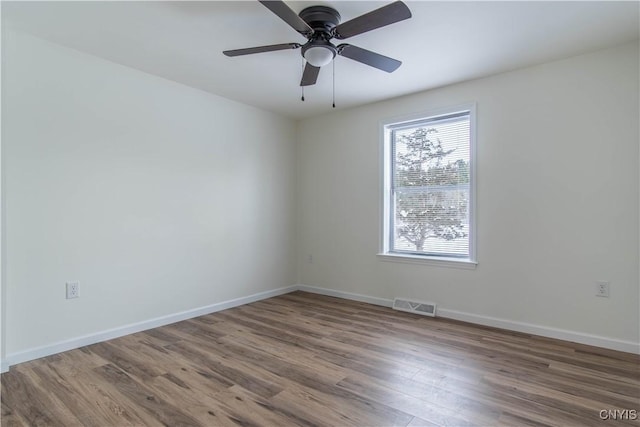 unfurnished room featuring ceiling fan and hardwood / wood-style floors