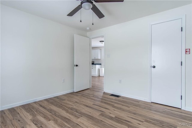 unfurnished bedroom featuring ceiling fan and light hardwood / wood-style floors