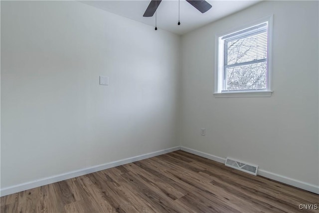 spare room featuring ceiling fan and hardwood / wood-style floors