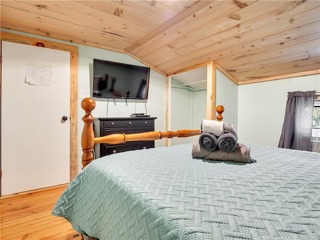 bedroom with wood-type flooring, lofted ceiling, and wooden ceiling