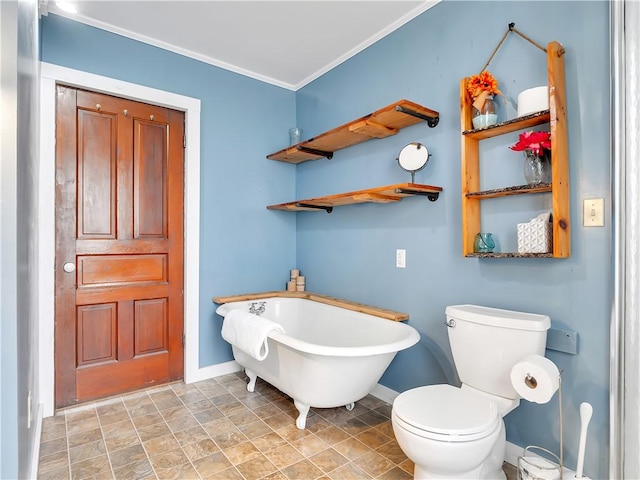 bathroom with crown molding, a tub, and toilet