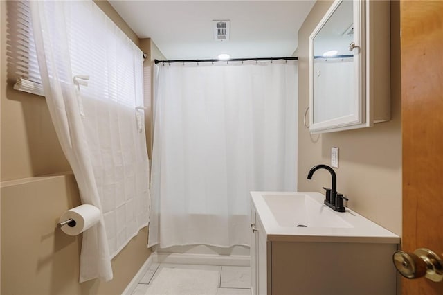 bathroom featuring shower / bath combination with curtain and vanity