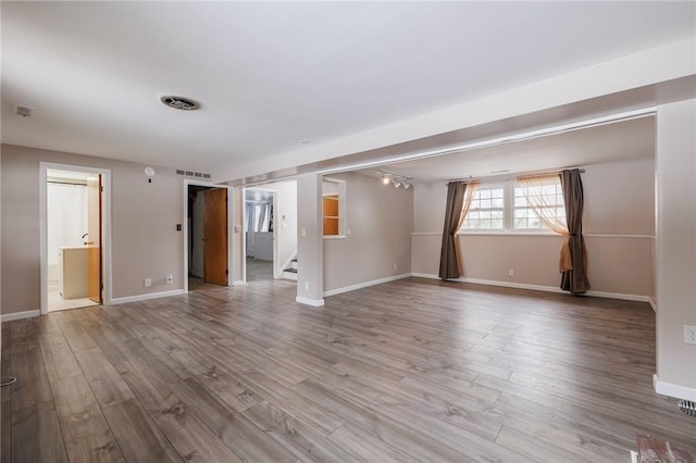 unfurnished room featuring light wood-type flooring