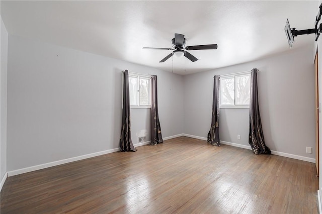 unfurnished room with hardwood / wood-style floors and ceiling fan