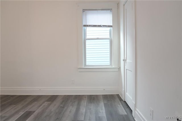 empty room with wood-type flooring