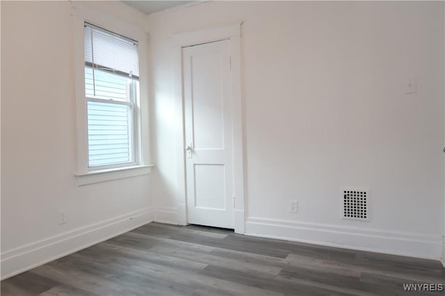 empty room featuring hardwood / wood-style flooring