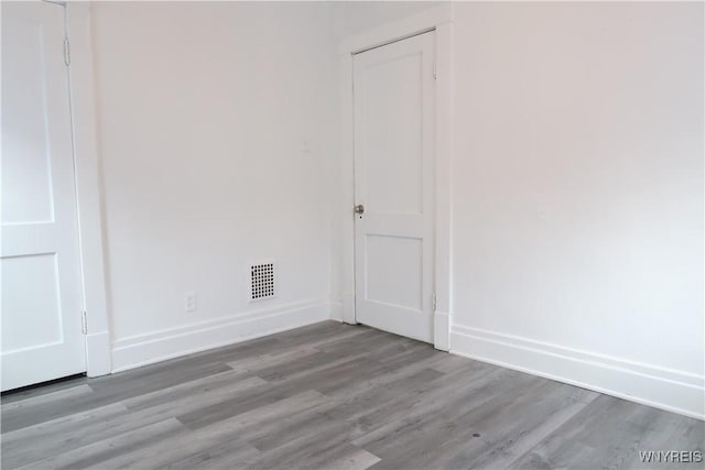 empty room with light hardwood / wood-style floors