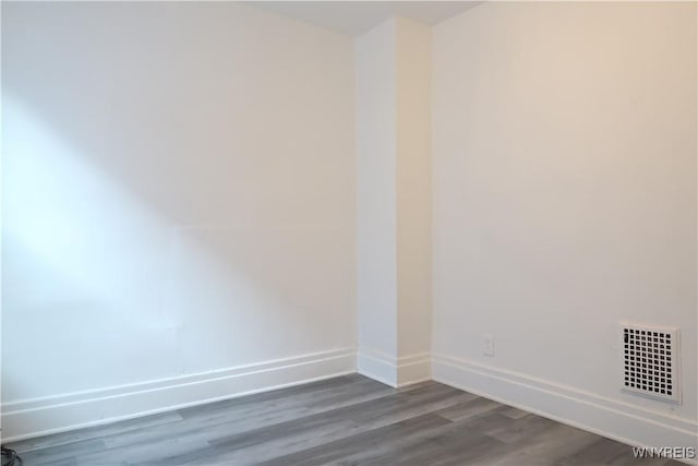 empty room with wood-type flooring