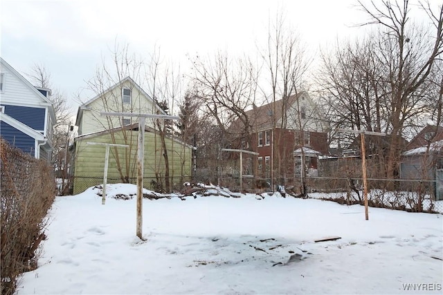 view of yard layered in snow