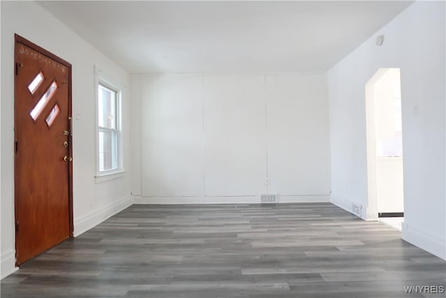 entrance foyer with dark hardwood / wood-style floors