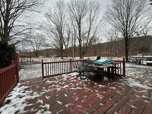 view of snow covered deck