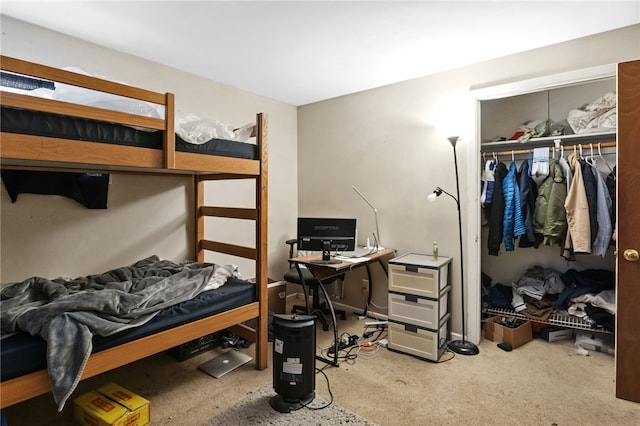 bedroom with carpet and a closet