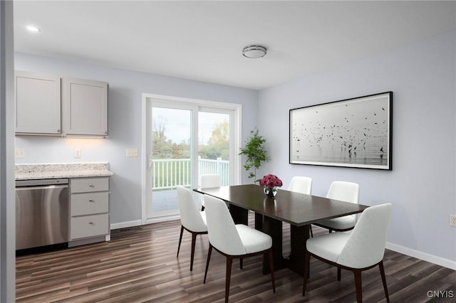 dining area with dark hardwood / wood-style flooring