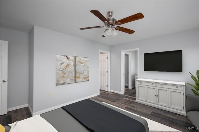 interior space featuring dark wood-type flooring and ceiling fan