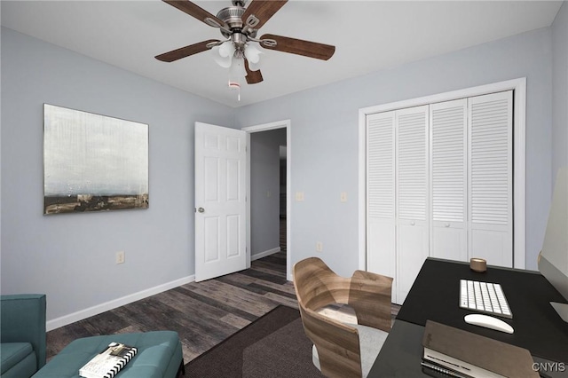 office space featuring dark hardwood / wood-style floors and ceiling fan