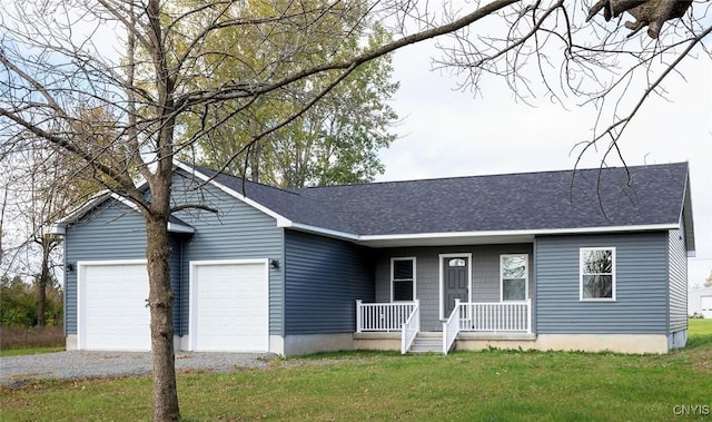 single story home with a garage, a front yard, and a porch