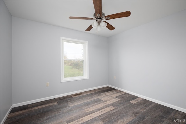 empty room with ceiling fan and dark hardwood / wood-style floors