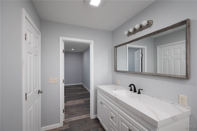 bathroom featuring vanity and hardwood / wood-style flooring