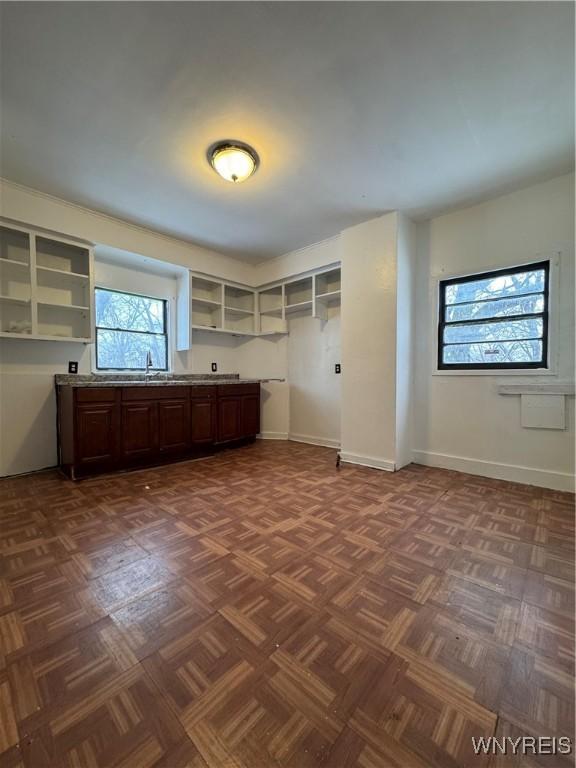 interior space featuring sink and dark parquet floors