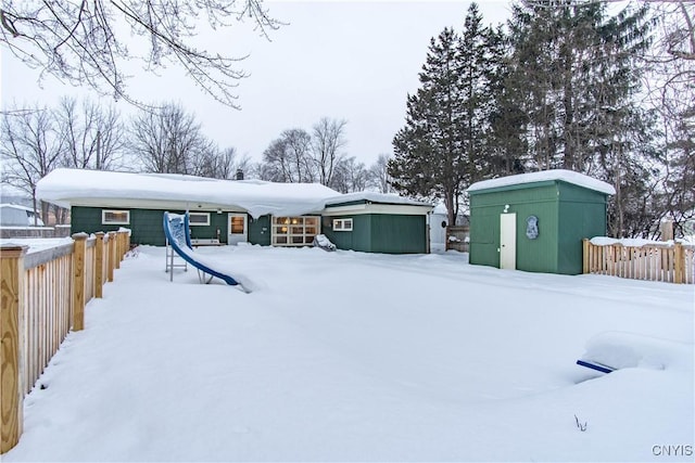 view of front of home featuring an outbuilding