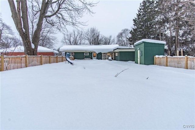 view of front of house with a storage shed