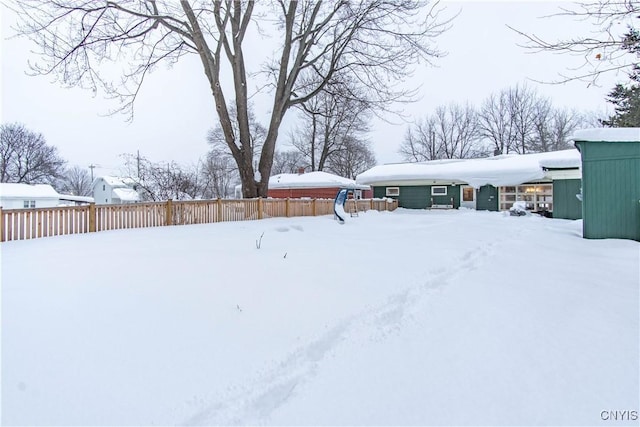 view of yard covered in snow