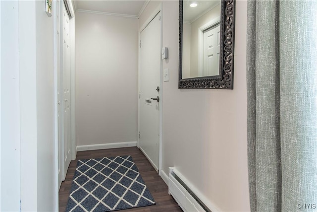 hall with ornamental molding and dark hardwood / wood-style floors