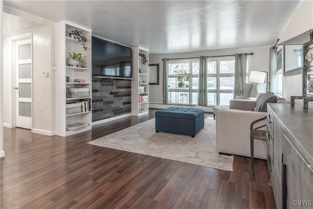 living room featuring dark wood-type flooring and ornamental molding