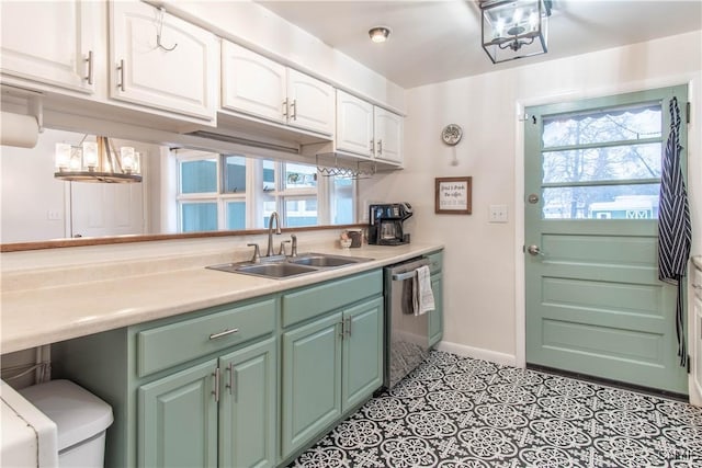 kitchen featuring sink, light tile patterned floors, dishwasher, and white cabinets