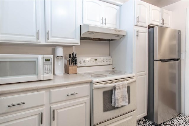 kitchen with white cabinets and white appliances