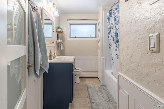 full bathroom featuring tile patterned floors, toilet, ornamental molding, vanity, and shower / bath combination with curtain