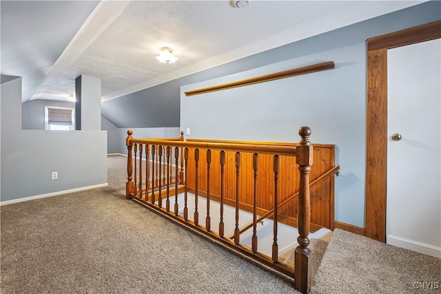 bonus room featuring lofted ceiling and carpet