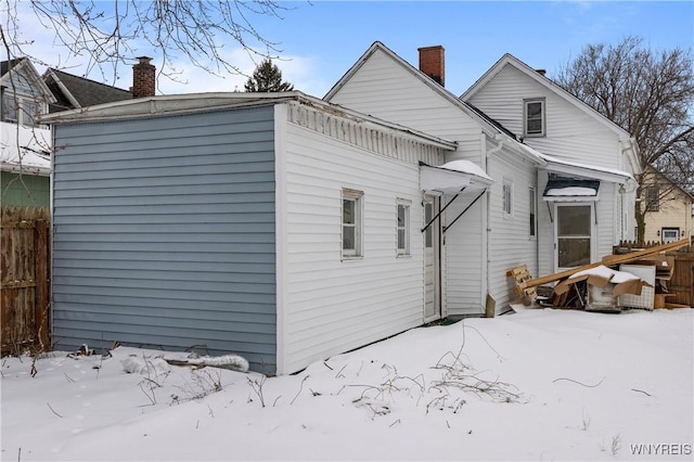 view of snow covered house