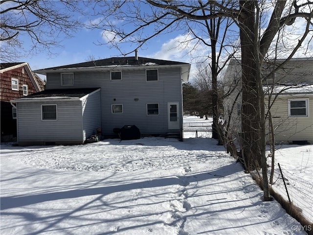 view of snow covered house