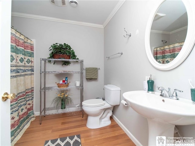 bathroom with toilet, sink, crown molding, wood-type flooring, and a shower with shower curtain