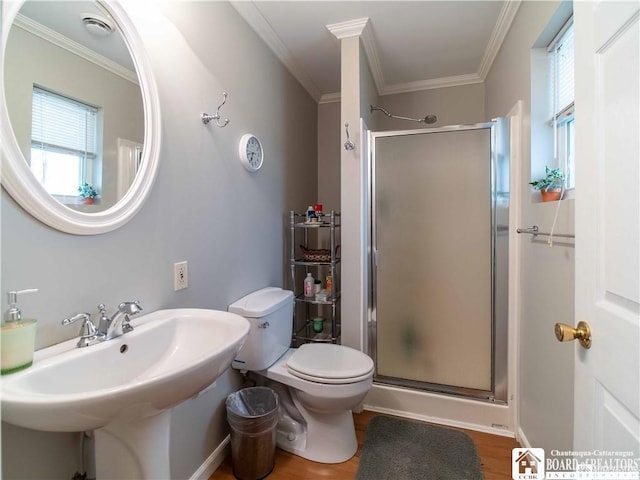 bathroom featuring a healthy amount of sunlight, an enclosed shower, and wood-type flooring